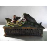 A vintage cast iron novelty money box in the form of Noah and the Whale with sprung kinetic