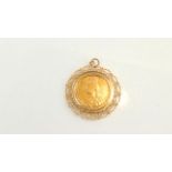 A full sovereign pendant, 1892, with 9ct gold rope-twist border, 11.6g