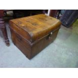 A vintage tin trunk with original simulated timber paintwork
