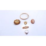 A 9ct gold hinged bangle, 6.8g; a 9ct gold paste-set brooch, of oval form; an untested citrine ring,