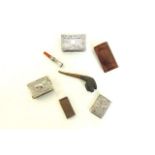 A silver match box case, a further Indian example, a plated example in book form, a Dunhill