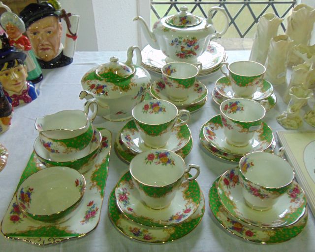 A collection of Paragon Rockingham pattern tea wares comprising two graduated teapots, a milk jug,