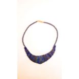 A lapis lazuli fringe necklace, with gilt metal clasp