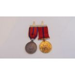 A 1902 Coronation Metropolitan Police Medal (bronze) and a Coronation Police Medal 1911 (silver),