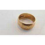 A 9ct gold wedding ring, with worn scrolling details, 5.2g, size L