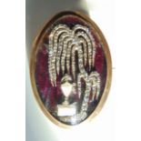 A Georgian mourning clasp, of oval form, the purple guilloche enamelled ground highlighted with a