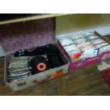 A suitcase containing a large quantity of miscellaneous 45rpm records, together with another box
