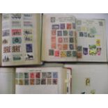Four albums containing GB and World stamps