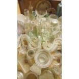 A quantity of antique glass ink bottles, salts and other small bowls, twisted epergne branches,
