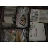 Four boxes of stamps including stamped first day issues, several bags of loose stamps (unsorted),