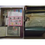 Two boxes containing a large quantity of stamps, stamp albums, envelopes, etc