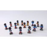 A collection of Robertson Golly figures comprising ten musicians and four footballers