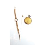 A lady's 9ct gold wristwatch, Tissot, the dial with gilt baton numerals, on a 9ct gold mesh bracelet