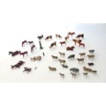 A collection of approximately thirty vintage painted lead model farm animals to include cows,