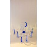 Six boxed Orrefors drinking glasses with clear bowls and feet united on blue stems, 22 cm tall