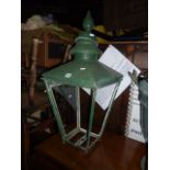 A Victorian street lantern hood of square tapered form with raised finial and green painted