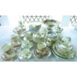 A collection of Royal Worcester Royal Garden Elgar pattern tea wares comprising a circular cake