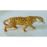 A Beswick model of a prowling leopard with printed circular mark to base