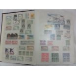 A stock book containing a large collection of worldwide stamps from Australia to St Vincent,