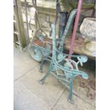 A small vintage "Ironcrete" garden roller, a further small cast iron hand operated water pump and