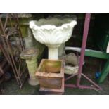 A pair of weathered cast composition stone two sectional garden planters with circular foliate bowls