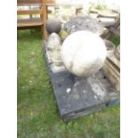 Six weathered cast composition stone finials of varying design, the largest in the form of a