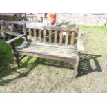 A weathered teak two seat garden bench with slatted seat and back, labelled to side Alby & Son