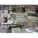 An extensive collection of Royal Mail Mint issue stamps in original packages (250 approx) together