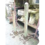 A pair of vintage cast iron lawn tennis posts complete with net winding mechanism, (stamped