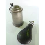 A 19th century brass mounted powder flask clad in stitched blackened leather together with a