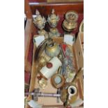 An assortment of eastern and other brassware to include a pair of lidded pierced vases, a brass