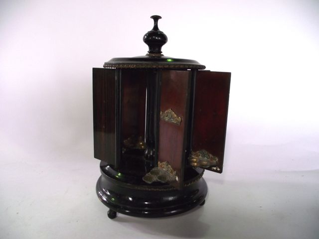 A rosewood veneered mechanical cigarette dispenser with seven compartments raised on a circular base - Image 2 of 3