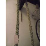 A length of weathered marine rope with double plaited detail, seven meters in length approximately