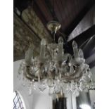 A good quality clear cut glass twelve branch ceiling hanging electrolier with gilded metallic mounts