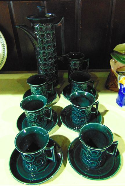 A collection of Portmeirion coffee wares designed by Susan Williams Ellis in a dark teal colourway