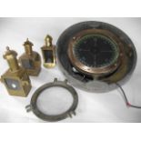 An extensive early 20th century ships compass set initially within a brass housing (25 cm diameter