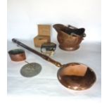 A 19th century copper coal helmet together with a brass sundial, a lined antique copper vessel of