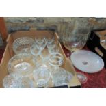 A box containing a quantity of clear cut glass sundae bowls, drinking glasses, further bowls, an
