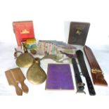 A miscellaneous collection to include a heavy brass boat rudder, a 20th century military machete set