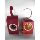 A vintage Saxon lamp in red painted casing with red convex lenses in white apertures together with a