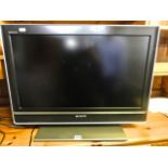 A Sony Bravia 26 inch flat screen television, model number KDL-26T3000 complete with remote control