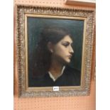 An early 20th century oil painting on canvas, shoulder length profile portrait of a young woman with