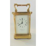 A brass carriage clock with 8 day timepiece, the dial marked Garrard & Co, London