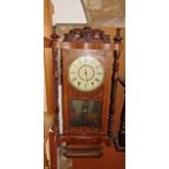 A late 19th century American wall clock with straw work marquetry frame, the two train movement with