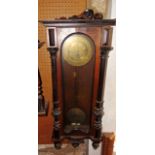 A 19th century walnut Vienna regulator style wall clock with engraved enamel dial and two train