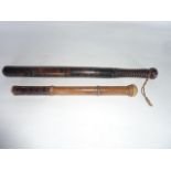 A good quality Victorian turned timber policeman's truncheon, the shaft with all over blackened