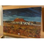 A 20th century Australian oil painting on canvas of Ayers Rock, indistinctly signed bottom right