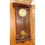 A late 19th century Vienna style wall clock with single train weight driven movement, the casework