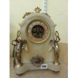 A Victorian gothic style mantle clock, the case in alabaster surmounted by gilded angels, the