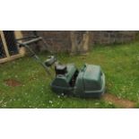 An Atco Balmoral 17S cylinder petrol mower with scarifier cassette